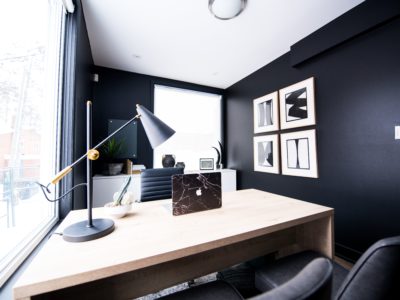 Sleek room with desk and black walls