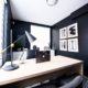Sleek room with desk and black walls